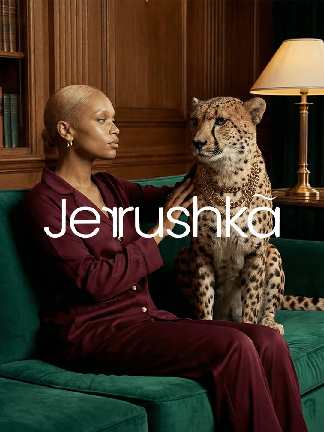 Jerrushka wordmark over a campaign photo of a woman and a cheetah on a green sofa